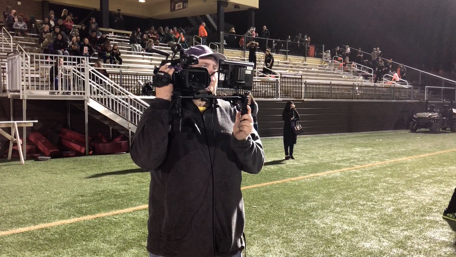 Nick Dalhoff working wireless sideline camera at a Marshall HS football game